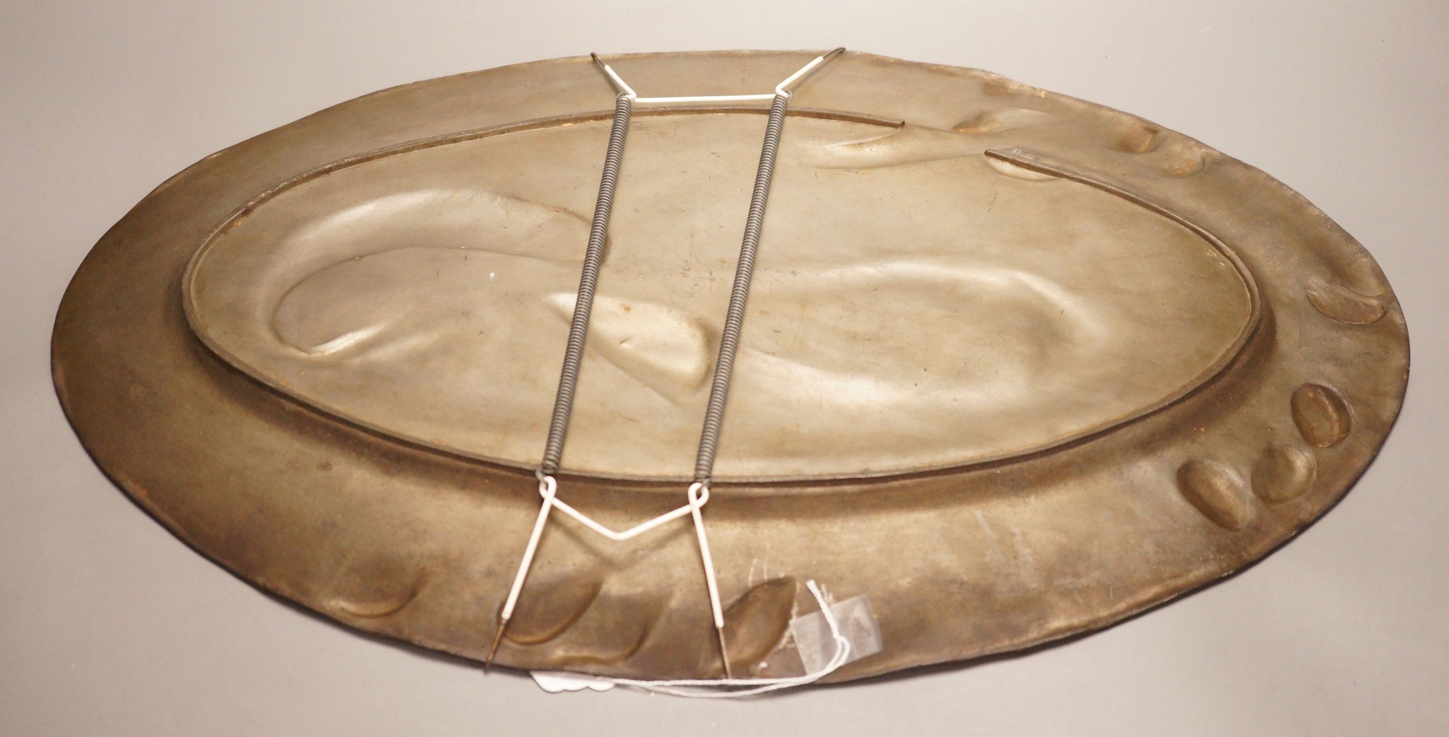 An early 20th century Continental pewter platter, decorated with fish, 52cm